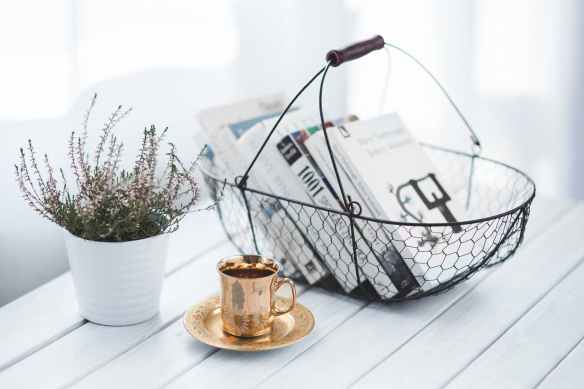 golden cup and basket with books